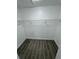 Large walk-in closet with wire shelving and grey wood-look floors at 620 Heraldo Ct, Kissimmee, FL 34758