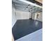 Spacious garage with epoxy floor and ample storage at 620 Heraldo Ct, Kissimmee, FL 34758