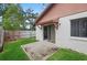 View of backyard with a concrete patio area and green lawn with a fenced border at 654 Boniview Ln, Altamonte Springs, FL 32714