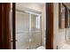 Bathroom featuring glass shower with tile, commode, and wood-framed mirror and cabinets at 654 Boniview Ln, Altamonte Springs, FL 32714