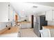 Bright kitchen with white cabinets, butcher block counters, stainless steel appliances, and tile flooring at 654 Boniview Ln, Altamonte Springs, FL 32714