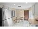 Bright breakfast nook with white cabinets, butcher block counters, stainless steel appliances, and tile flooring at 654 Boniview Ln, Altamonte Springs, FL 32714