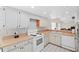 Bright kitchen with white cabinets, butcher block counters, and white appliances with tile flooring at 654 Boniview Ln, Altamonte Springs, FL 32714