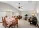 Open concept living and dining room with vaulted ceilings and ceiling fan at 654 Boniview Ln, Altamonte Springs, FL 32714
