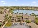 Aerial view of townhouses near a lake with parking and landscaping at 670 Lake Villas Dr # D, Altamonte Springs, FL 32701