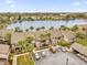 Aerial view of townhouses near a lake with parking and landscaping at 670 Lake Villas Dr # D, Altamonte Springs, FL 32701