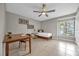 Bright bedroom with a bed, desk, and tiled floors at 670 Lake Villas Dr # D, Altamonte Springs, FL 32701