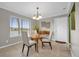 Dining room with glass table and lake view at 670 Lake Villas Dr # D, Altamonte Springs, FL 32701