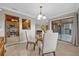 Dining room with glass table and view into kitchen at 670 Lake Villas Dr # D, Altamonte Springs, FL 32701