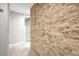 Hallway with stone accent wall and access to closets at 670 Lake Villas Dr # D, Altamonte Springs, FL 32701