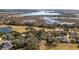 Aerial view of the house and surrounding golf course community at 8835 Spyglass Loop, Clermont, FL 34711