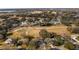 Aerial view of house and surrounding golf course community at 8835 Spyglass Loop, Clermont, FL 34711