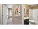Clean bathroom with granite countertop and a shower/tub combo at 8835 Spyglass Loop, Clermont, FL 34711