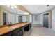 Elegant bathroom with granite counters and soaking tub at 8835 Spyglass Loop, Clermont, FL 34711