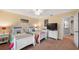 Spacious bedroom with twin beds, nightstands, and a dresser at 8835 Spyglass Loop, Clermont, FL 34711