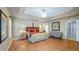 Bright bedroom with wood floors and sitting area at 8835 Spyglass Loop, Clermont, FL 34711