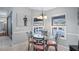 Charming breakfast nook with glass table and four chairs at 8835 Spyglass Loop, Clermont, FL 34711