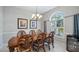 Elegant dining room with ornate wood table and chairs at 8835 Spyglass Loop, Clermont, FL 34711