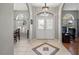 Elegant entryway with double doors and tile flooring at 8835 Spyglass Loop, Clermont, FL 34711