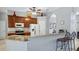 Open kitchen boasts granite counters and breakfast bar at 8835 Spyglass Loop, Clermont, FL 34711