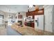 Spacious kitchen with granite countertops and modern appliances at 8835 Spyglass Loop, Clermont, FL 34711