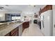 Modern kitchen with granite island and stainless steel appliances at 8835 Spyglass Loop, Clermont, FL 34711