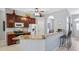 L-shaped kitchen with granite counters and breakfast nook at 8835 Spyglass Loop, Clermont, FL 34711
