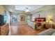 Spacious main bedroom with hardwood floors and a king-size bed at 8835 Spyglass Loop, Clermont, FL 34711
