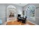 Bright office space with wood floors, large window, and view of the street at 8835 Spyglass Loop, Clermont, FL 34711