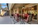 Covered patio with table and chairs, overlooking backyard at 8835 Spyglass Loop, Clermont, FL 34711