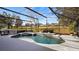 Relaxing pool and spa area with screened enclosure at 8835 Spyglass Loop, Clermont, FL 34711