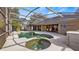 Inviting screened pool and spa with outdoor seating at 8835 Spyglass Loop, Clermont, FL 34711