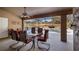 Covered patio with pool views and outdoor dining area at 8835 Spyglass Loop, Clermont, FL 34711