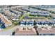 Community overview showcasing homes, landscaping, and lake at 9218 Shepton St, Orlando, FL 32825