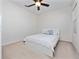 Bright bedroom with a white bed frame and a ceiling fan at 9218 Shepton St, Orlando, FL 32825
