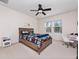 Bedroom with Star Wars bedding, ceiling fan, and built-in desk at 9218 Shepton St, Orlando, FL 32825