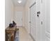 Bright and airy entryway with tile flooring and storage console at 9218 Shepton St, Orlando, FL 32825