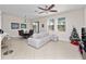 Bright living room featuring a comfy sofa and large windows at 9218 Shepton St, Orlando, FL 32825