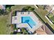 Community pool with plenty of lounge chairs at 9218 Shepton St, Orlando, FL 32825