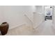 Upstairs hallway with carpeted floor and a decorative vase at 9218 Shepton St, Orlando, FL 32825