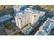 An aerial view of a modern high-rise condo building featuring a swimming pool and lounge area at 100 S Eola Dr # 1405, Orlando, FL 32801