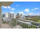 Enjoy breathtaking city views from this spacious balcony with white railings and a clear sky backdrop at 100 S Eola Dr # 1405, Orlando, FL 32801