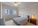 Simple bedroom design features large windows with natural light, and furnishings at 100 S Eola Dr # 1405, Orlando, FL 32801