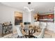 Chic dining area with modern lighting, designer furniture, and an open layout flowing into the kitchen at 100 S Eola Dr # 1405, Orlando, FL 32801