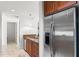 Modern kitchen design with stainless steel refrigerator and granite countertops in a contemporary style at 100 S Eola Dr # 1405, Orlando, FL 32801