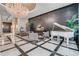 Grand lobby featuring a sparkling chandelier, a white piano, and luxurious decor at 100 S Eola Dr # 1405, Orlando, FL 32801