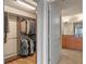 Spacious walk-in closet with custom shelving, rods, and view into the bathroom at 100 S Eola Dr # 1405, Orlando, FL 32801