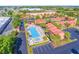 Community pool and spa with surrounding parking and units at 1007 Baseball And Boardwalk Ct, Kissimmee, FL 34746