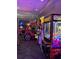 Fun arcade with various games and colorful lighting at 1007 Baseball And Boardwalk Ct, Kissimmee, FL 34746