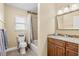 Bathroom featuring vanity with granite counters and shower-tub combo at 1007 Baseball And Boardwalk Ct, Kissimmee, FL 34746